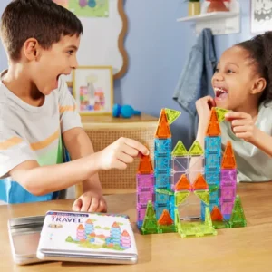 two children play with large magnatile castle structure made of mini magnatiles
