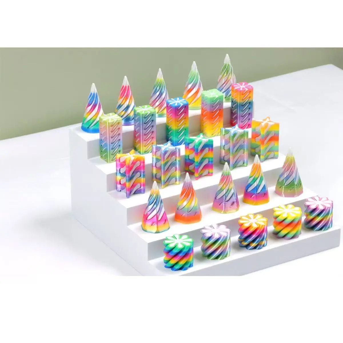 tiered shelf of rainbow colored fidgets in different shapes