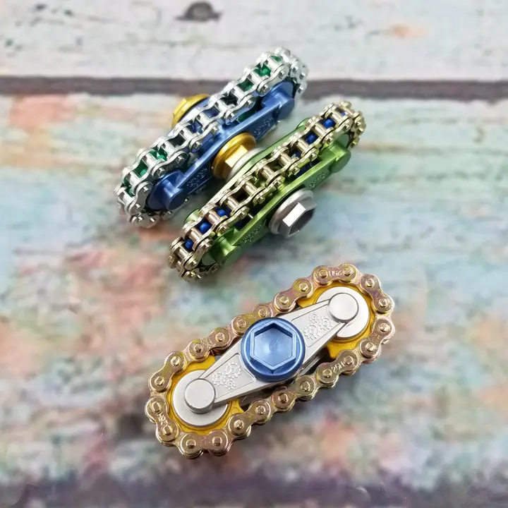 fidgets with bike chain over two gears