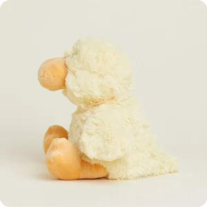 side view of light yellow duck with orange feet and bill, rounded wings