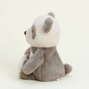 side view of panda has cream head with grey ears and patches around eyes