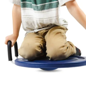 child sitting on knees on seat, shows knob on the bottom that keeps the seat uneven