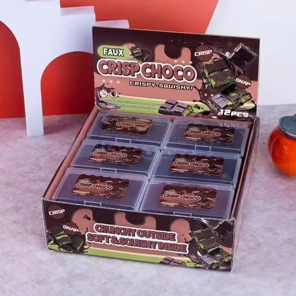 display case shows fake chocolate bars in a clear plastic case