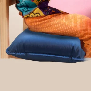 person sitting on a blue cushion atop a chair