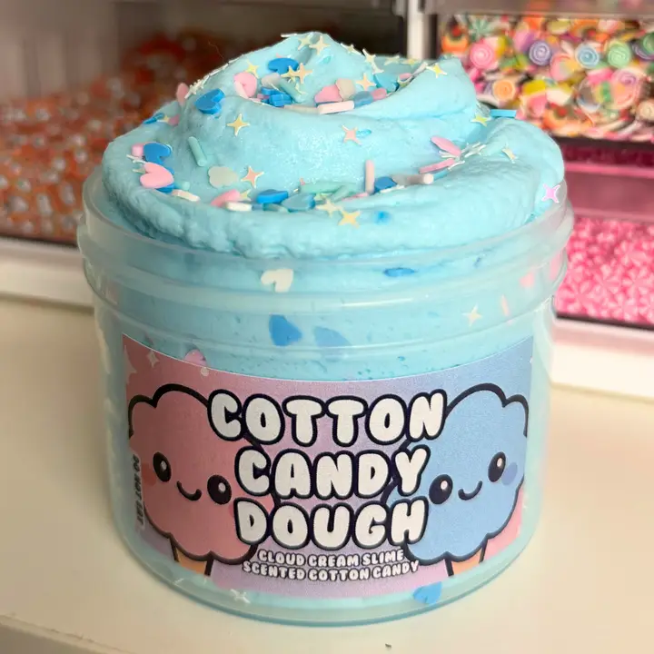 jar of cotton candy slime that is light blue with multicolored sprinkles in different shapes