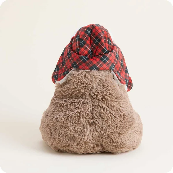 back of capybara shows red and green plaid hat