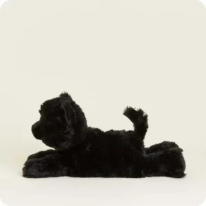 side view with cat lying down and legs extended out, mid length tail is extended up