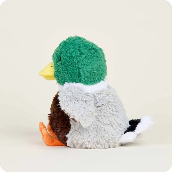 side view of duck stuffie with green head, yellow beak, brown belly and grey back/wings, and orange feet, and black and white tail
