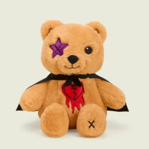 tan teddy bear with star "X" eye, cape and broken heart patch