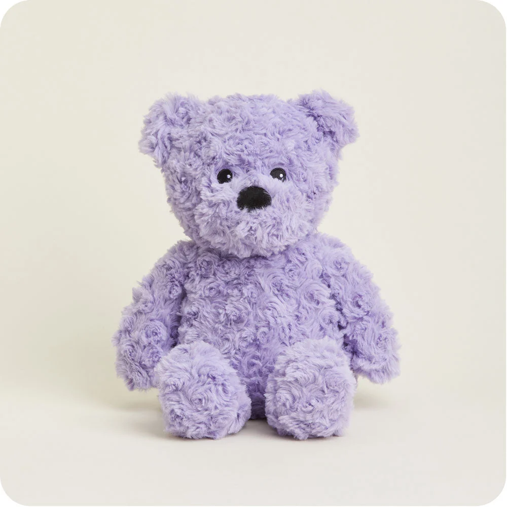 lavender colored teddy bear with short curly fur