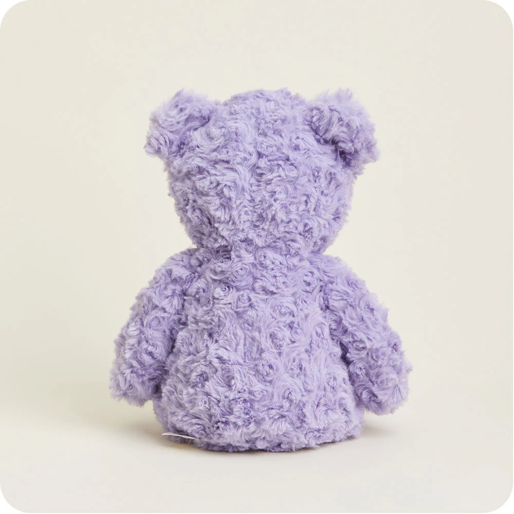 back of lavender colored teddy bear with short curly fur, no tail