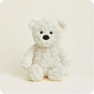 cream colored teddy bear with short curly fur