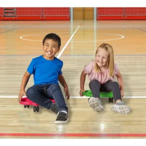 two children each on a scooter in a gymnasium